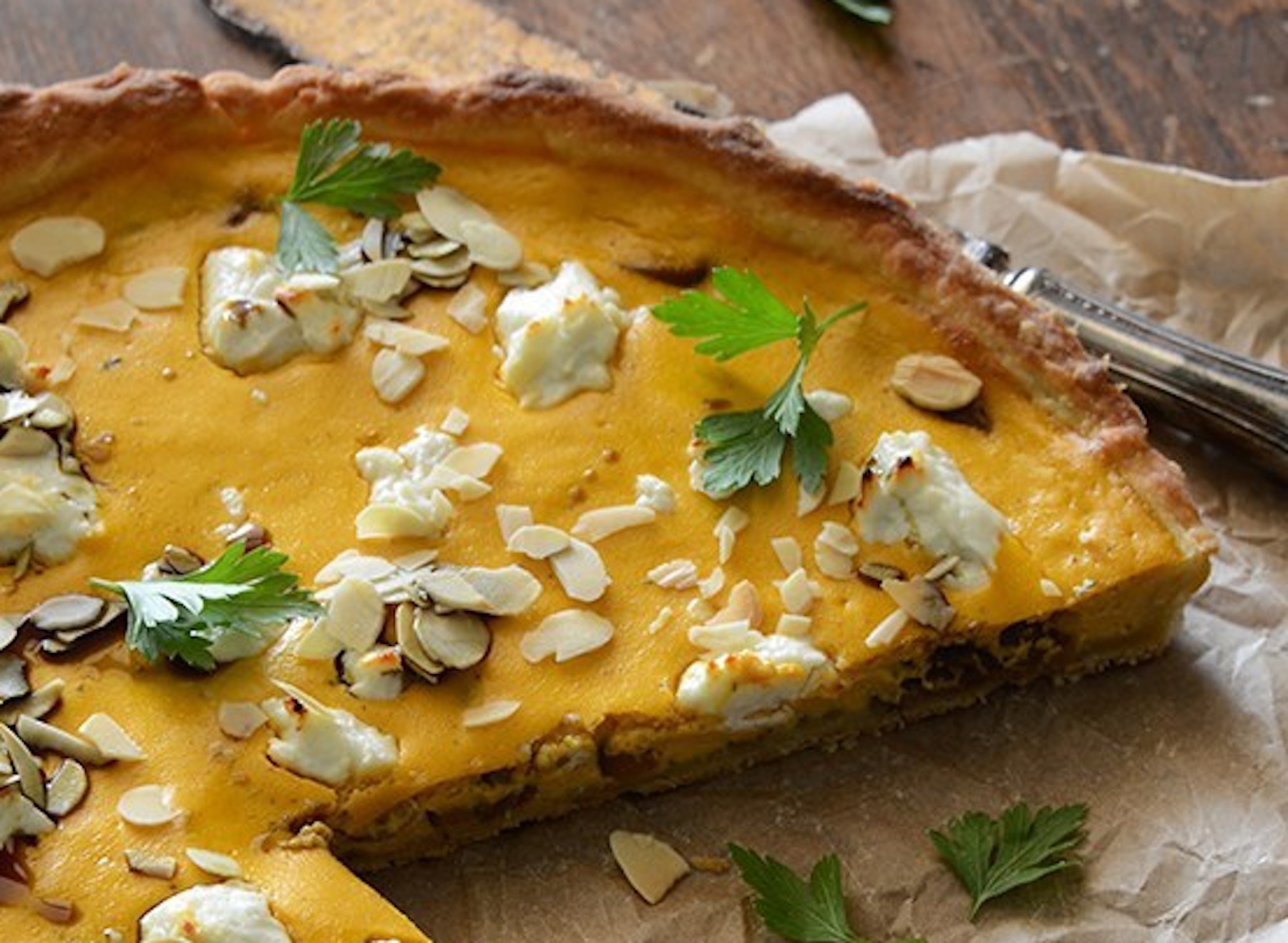 Savory pumpkin ricotta and caramelized onion tart with goat cheese